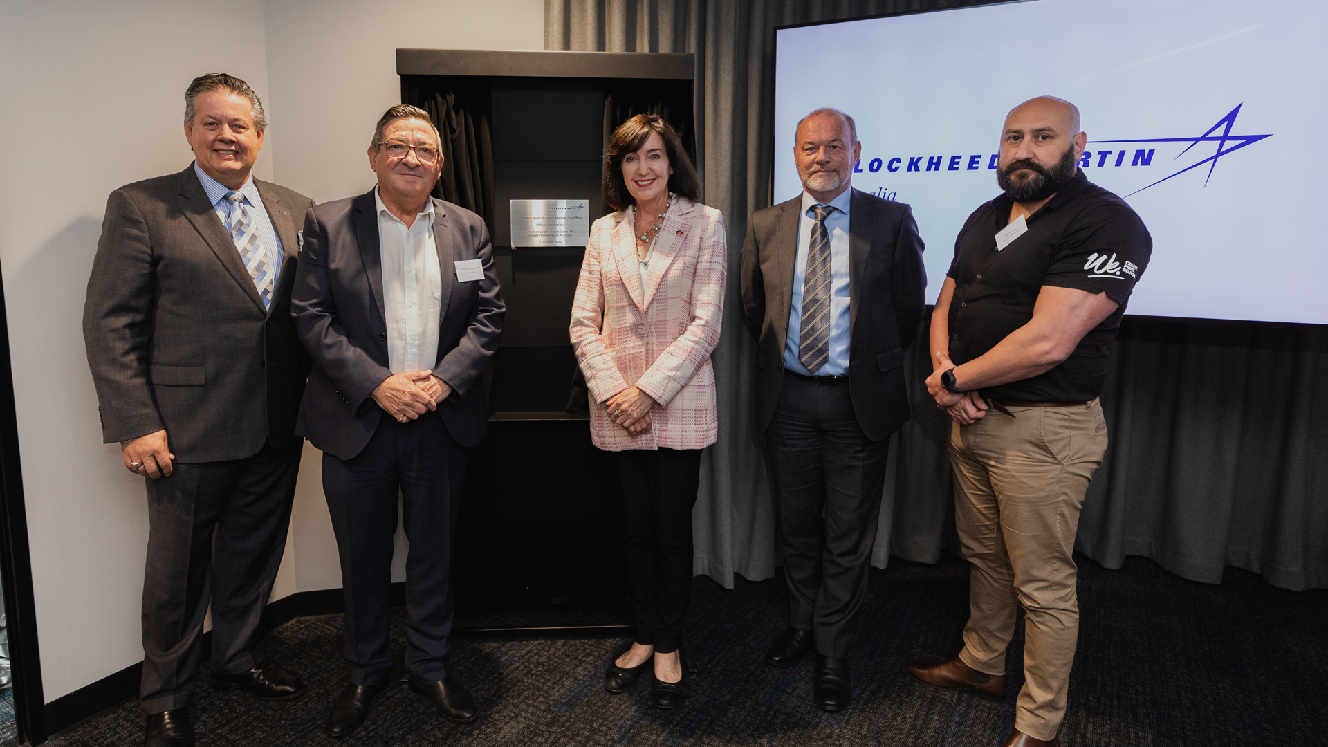 Steve Froelich, Vice President of Operations Lockheed Martin RMS Australia and New Zealand together with Steve Georganas MP, Member for Adelaide and Chair of Joint Standing Committee on trade and Investment Growth, the Hon Susan Close, Deputy Premier of South Australia, Richard Price, Chief Executive DefenceSA, and Pat Caruso, Indigenous Artist, We Create Print Deliver at the opening of Lockheed Martin Australia’s Adelaide City Office.